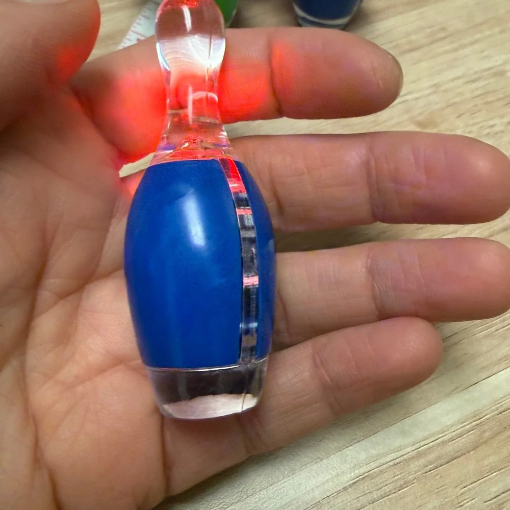 Set of 4 Bowling Pin Light Up LED Keychains Blue Green Orange Novelty